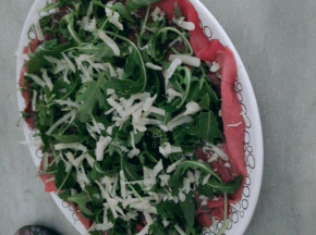 Carpaccio con rucola e grana