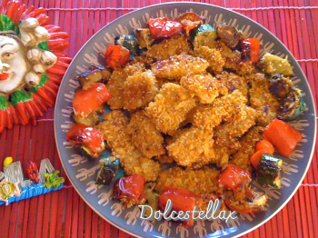 Nuggets di pollo croccante con corn flakes e semi di sesamo e verdure gratinate