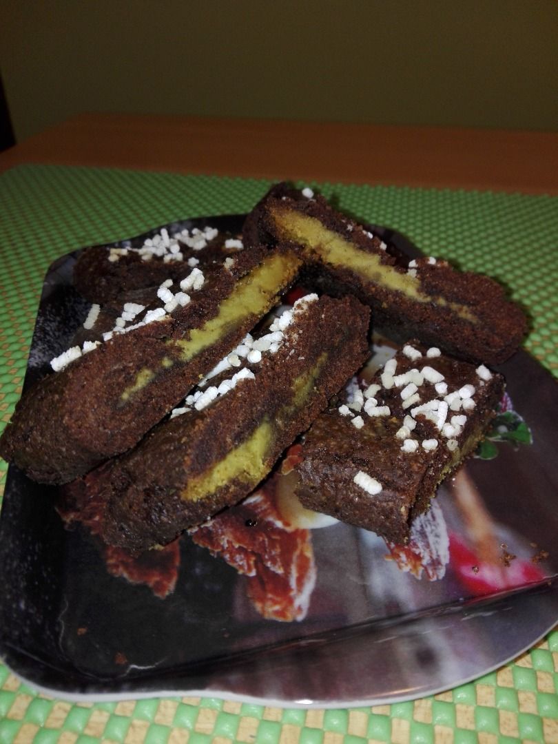 immagine post Biscotti al cacao arrotolati con crema al pistacchio